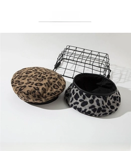 Detail of leopard print wool berets in classic brown and cool grey stylish animal patterns
