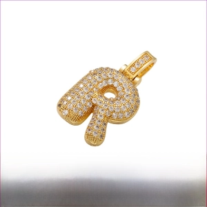 Detailed view of gold letter R pendant with brass base, micro-paved zircons, 20x29mm size