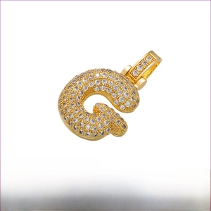 Close-up of gold-plated brass letter G pendant with cubic zirconia inlay 20x29mm