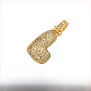 Macro detail of gold-plated brass letter L pendant with white cubic zirconia stones