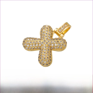 Macro view of gold plated brass cross pendant with micro-pave cubic zirconia stones