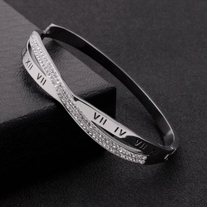 Silver roman numeral crisscross bangle with sparkling white cubic zirconia stones