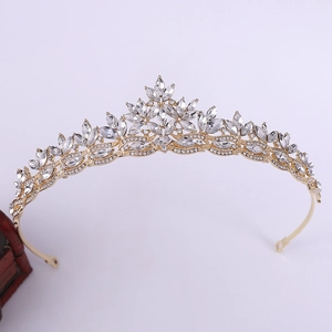 Detailed macro view of leaf-shaped bridal crown with crystals and golden plating