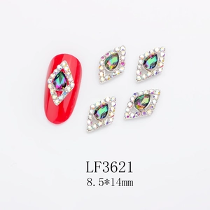 Detail of 8.5x14mm rhombus nail charm with iridescent teardrop stone and white crystals