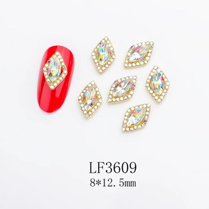 Detailed view of red rhombus aurora nail art rhinestones with 8x12.5mm metal frames