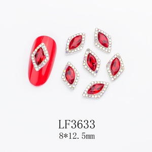 Macro detail of red rhombus crystals with silver edges for bridal nail art accessories
