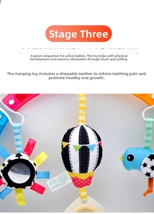 Detail of infant stroller clip toy with a sun mirror, bird plush, and teether for sensory play