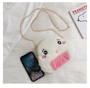 Close-up of cute plush rice ball bag with pink ears and elegant gold chain strap