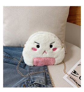 Detail of cute plush onigiri bag with soft white fur and gold chain strap