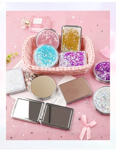 Collection of portable glitter quicksand makeup mirrors in various shapes and pastel colors