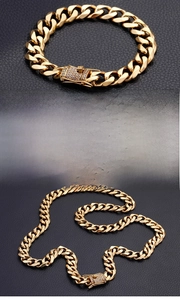 Macro detail of 13mm gold Cuban link chain with luxury iced out pavé diamond clasp