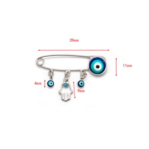 Detailed view of evil eye brooch pin with hamsa hand charm showing dimensions