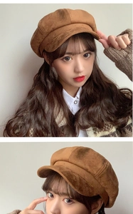 Detailed texture of brown suede newsboy cap showing premium stitching and retro fabric