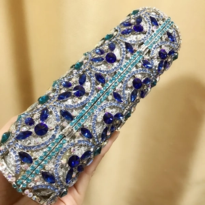 Detail of blue and silver rhinestone evening clutch with intricate vine-style crystal patterns