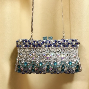 Detailed close-up of luxury rhinestone evening clutch bag with blue crystal fish scale pattern