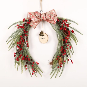 Christmas wreath with red berries, pine needles and X-MAS wooden sign on white background