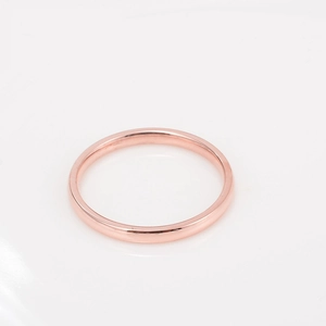 Elegant two-tone rose gold plated ring with oval-cut zircon stone on white background