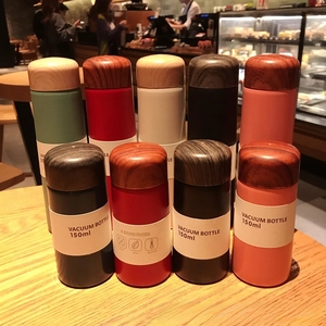 Detailed view of 150ml and 250ml mini vacuum flasks with wood grain textured caps