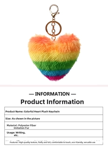 Close-up of rainbow gradient heart furry keychain with gold metal clasp detail