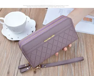 Detail of deep purple checkered long wallet featuring double zippers and fashion metal logo
