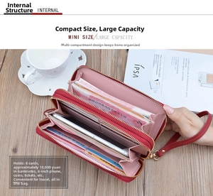 Internal view of red long wallet showing dual-zipper layers for phone and large capacity