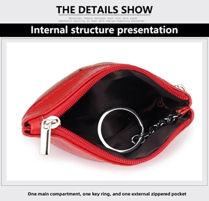 Detail view of red pebble leather coin purse showing interior main pocket and key ring