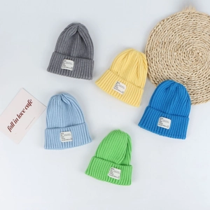 Winter knitted beanie hats for women in five vibrant candy colors with rib-knit texture