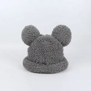 Close-up of thick grey plush material and cute Mickey style round ears on the winter hat