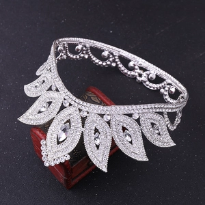 Close-up of baroque bridal crown with silver rhinestones on a vintage wooden box