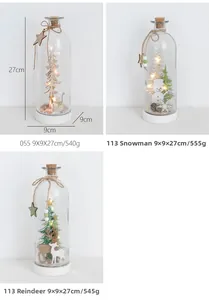 Detail view of 27cm LED Christmas glass bottle with snowman and reindeer wood carvings