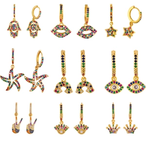 Set of 9 gold-plated hoop earrings with colorful zircon charms like Hamsa and Star