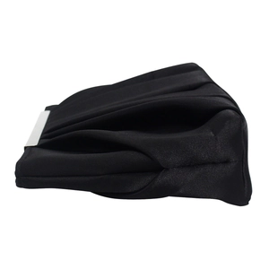 Macro side view of black pleated satin evening clutch bag with silver metal trim detail