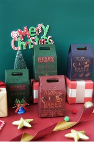 Detailed view of colorful Christmas gift boxes with handles in festive scene