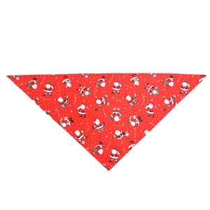 Detail of red Christmas pet bandana featuring cartoon Santa sports patterns and snowflakes