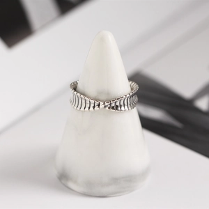 Macro shot of S925 sterling silver Mobius ring with retro twisted scale texture