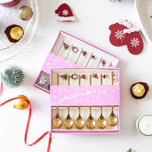 Close-up of 6-piece Christmas dessert spoon sets in elegant pink holiday gift packaging