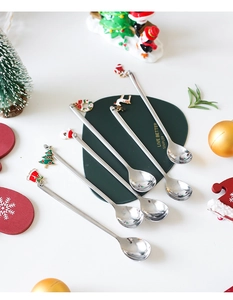 Set of 6 stainless steel coffee spoons featuring various colorful Christmas enamel charms