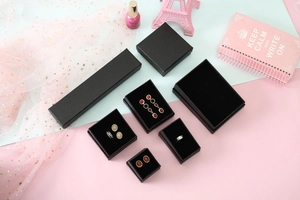 Detailed macro view of black pearl texture jewelry gift boxes for rings and necklaces