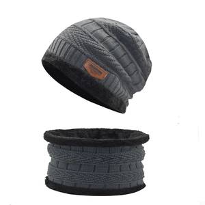 Close-up of cable knit winter hat and neck warmer set with warm fleece lining