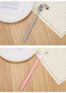 Detail of cute cat and rabbit cartoon characters on the top of gel ink pens