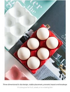 Detail of 6-slot ceramic egg tray in red, white and pink for stable kitchen storage
