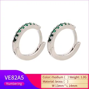 Detail of 14mm rhodium plated brass hoops with inlaid green zircon stones
