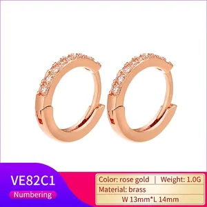 Macro detail of rose gold brass earrings with pave zircons and precise dimensions