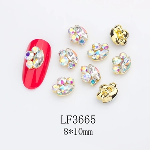 Detail of cat claw nail charms with k9 crystals and gold trim measuring 8x10mm