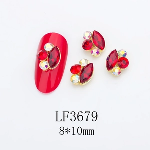 Detailed macro view of 8x10mm red marquise rhinestones with metal borders for nail art