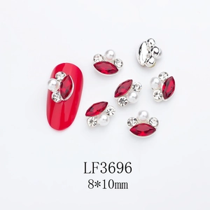 Detail of red marquise crystal nail charm with pearls and silver alloy frame