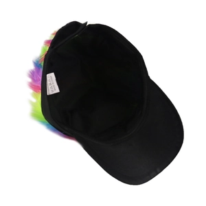 Inside view of black baseball cap with colorful hair wig detail and care label