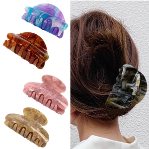 Large acetate hair claw clips set in various colors and patterns for women's updos