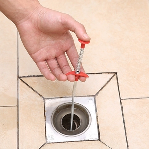 Flexible spring pipe unblocker tool with red handle for kitchen and bathroom drains