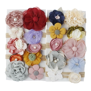 Set of 18 nylon flower headbands with pearls and rhinestones on display cards